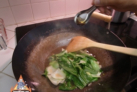 Simple Stir-Fried Bok Choy with Oyster Sauce - After a minute, a touch of sesame oil