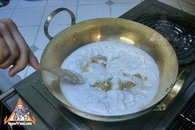 Thai Rice Balls in Warm Coconut Milk, 'Bua Loi' - Heat sugar &amp; coconut milk in brass wok