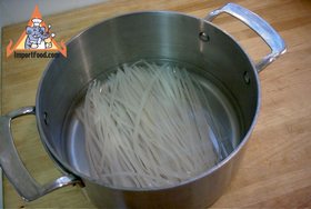 Thai-Style Noodles with Peanut Basil Sauce - Soak noodles