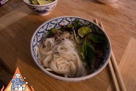 Vietnamese-Style Beef Noodle Soup - Garnish with fresh basil, etc
