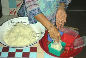 Thai Street Vendor for Thai Fermented Sweet Rice Dessert, 'Khao Mahk' - Step 11<br>Put the rice in airtight containers and let sit at room temperature for about 3 days.