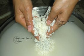 Thai Street Vendor for Thai Fermented Sweet Rice Dessert, 'Khao Mahk' - Step 2<br>Rinse rice thoroughly until water runs clear.