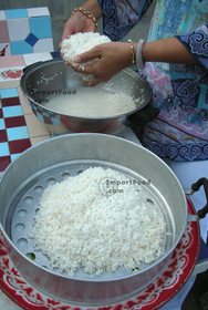Thai Street Vendor for Thai Fermented Sweet Rice Dessert, 'Khao Mahk' - Step 3<br>Set rice into stacked steamer (line with cheesecloth for best results) or use sticky rice steamer.