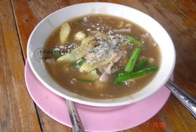 Thai Street Vendor for Thai-Style Wide Noodles In Thick Sauce, 'Kuaytiao Lad Na'