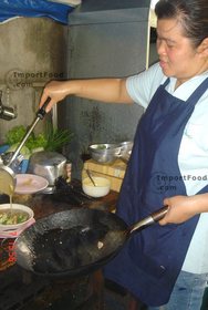 Thai Street Vendor for Thai-Style Wide Noodles In Thick Sauce, 'Kuaytiao Lad Na'
