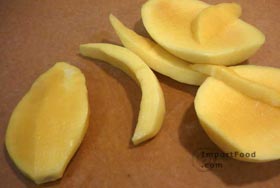 Thai Green Mango with Sweet Fish Sauce, 'Mamuang Nampla Wan' - Slice again, left of center. Discard the hard seed (above, seed is at left)