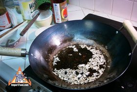Thai Crispy Fried Pork with Garlic, 'Moo Tod Gratiem' - Frying the sliced garlic