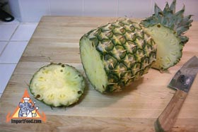 Peel and Slice Fresh Pineapple - Cut the bottom off