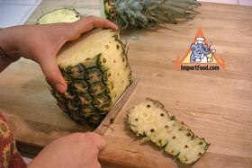 Peel and Slice Fresh Pineapple - Set upright, and slice downward to remove outer peel. Cut thin, leaving the "eyes".