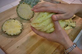 Peel and Slice Fresh Pineapple - With some salt the palm of each hand, rub.