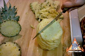 Peel and Slice Fresh Pineapple - Avoiding the center core, slice downward