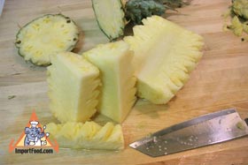 Peel and Slice Fresh Pineapple - Slice a few more times then discard the core
