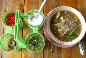 Thai Street Vendor for Thai-Style Wide Noodles In Thick Sauce, 'Kuaytiao Lad Na'