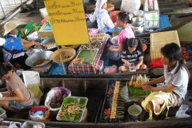 Satay sold from a boat in Thailand
