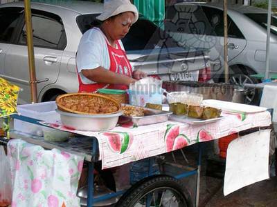 Thai Street Vendor Offers Haw Mukh from a Push Cart