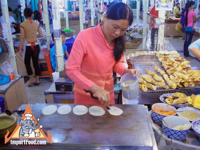 Thai Street Vendor Prepares Thai-Style Pancakes, 'Khanom Buang'