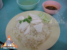 Thai Street Vendor Offers Khao Man Gai from a Shophouse Cart