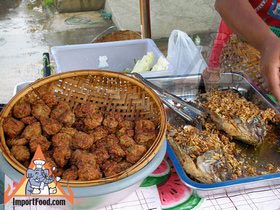 Thai Street Vendor Offers Haw Mukh from a Push Cart