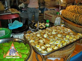 Thai Street Vendor Offers Quail Eggs Fried in Khanom Krok, 'Khai Nok Kra-Ta'