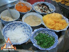Thai Street Vendor Prepares Thai-Style Pancakes, 'Khanom Buang'