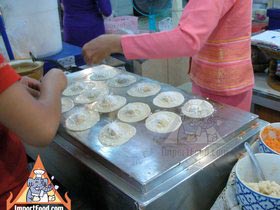 Thai Street Vendor Prepares Thai-Style Pancakes, 'Khanom Buang'