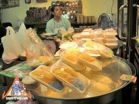 Bangkok Sidewalk Vendor Mae Varee Offers Sweets, Fresh Fruit and Sticky Rice - Sticky Rice Counter at Mae Varee
