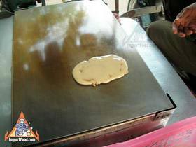 Thai Street Vendor Prepares Decorative Pancakes