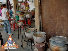 Thai Street Vendor Offers Chinese Herbal Soup from a Shophouse Cart