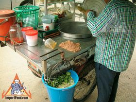 Thai Street Vendor Prepares Egg Noodle and Wonton Soup
