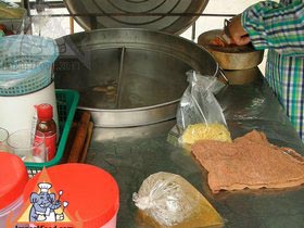 Thai Street Vendor Prepares Egg Noodle and Wonton Soup
