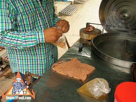 Thai Street Vendor Prepares Egg Noodle and Wonton Soup - Powered by Honda