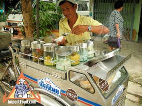 Thai Street Vendor Offers Candied Ice Cream from a Bicycle Cart