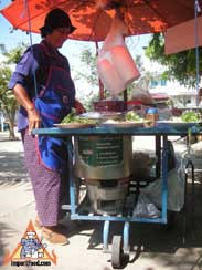 thai street vendor charcoal burner