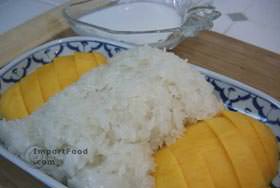 Serve on dish with sticky rice and sweet cream topping