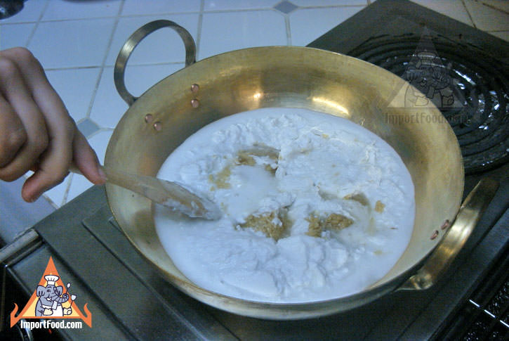 Heat sugar & coconut milk in brass wok