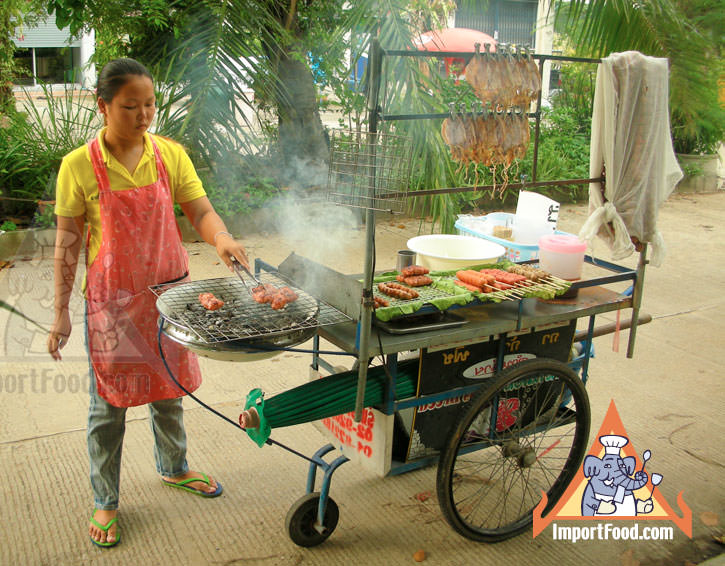 Thai Street Vendor Prepares Charcoal Barbecue Traditional Sausage