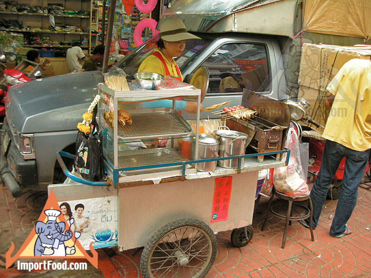 Thai Street Vendor Prepares Charcoal Barbecue Snacks, Luke Chinping