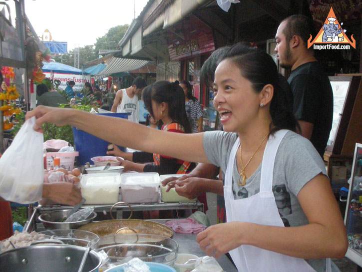 Thai Street Vendor prepares Bua Loi