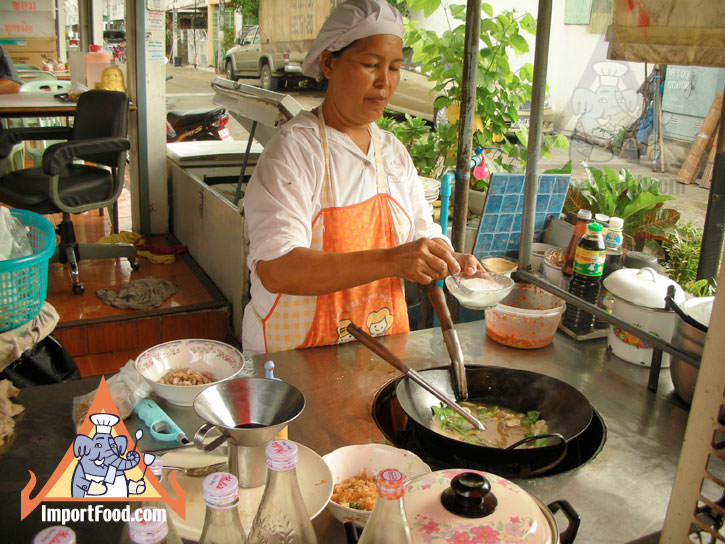 Thai Street Vendor Prepares Thai-Style Noodles in Gravy, Ladna