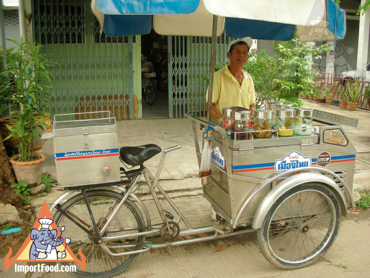 Thai Street Vendor Offers Candied Ice Cream from a Bicycle Cart